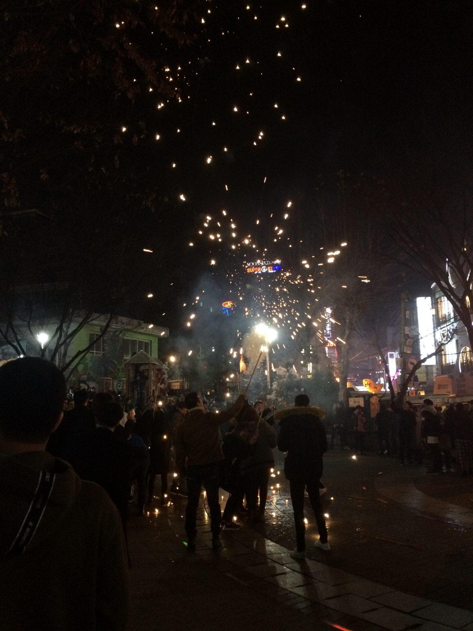 Fireworks set off in the playground in Hongdae around midnight.