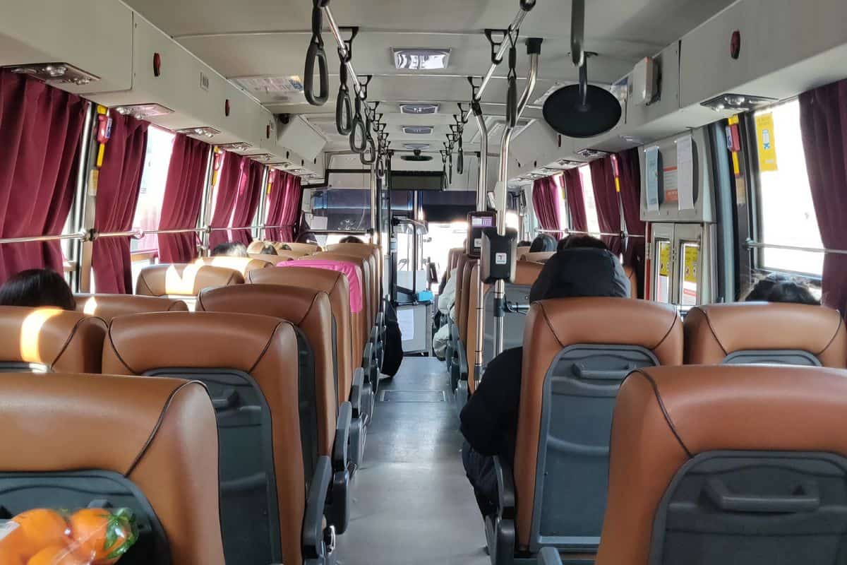 inside of an intracity bus in Korea, viewed from the very back seat.