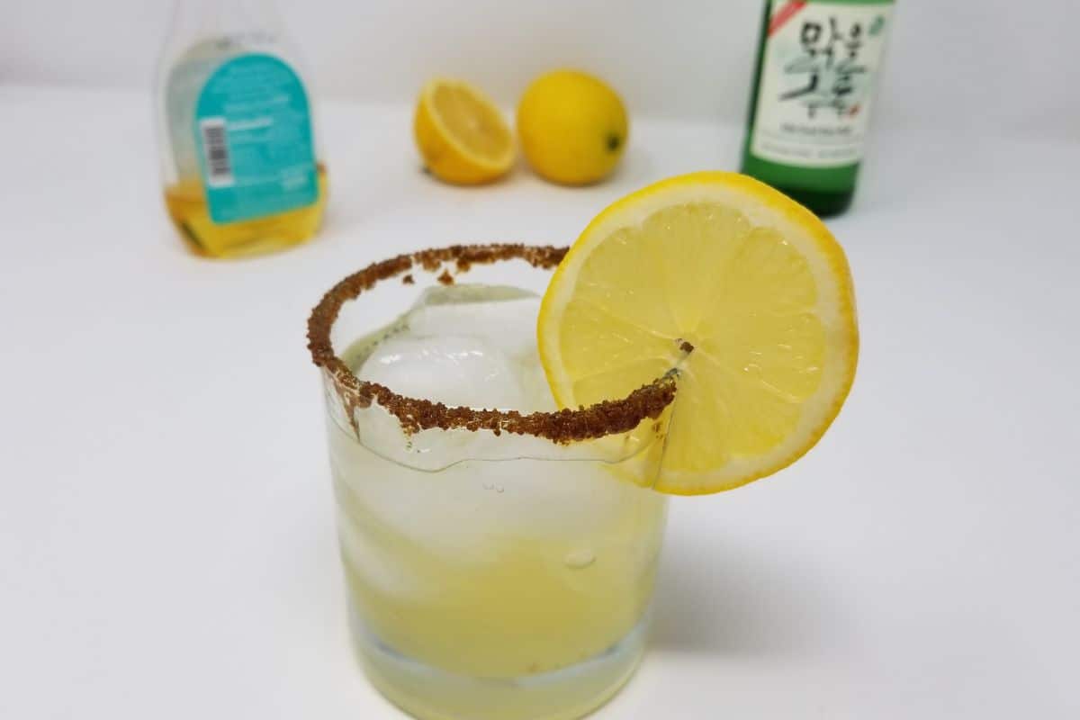 Lemon slice on a soju cocktail glass.