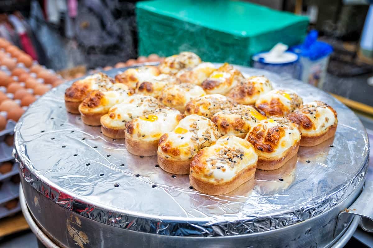 Egg bread with almond, peanut and sunflower seed at Myeong-dong street food, Seoul, South Korea.