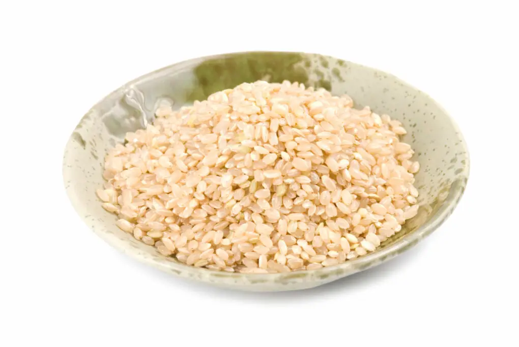 Brown short grain rice in a bowl.