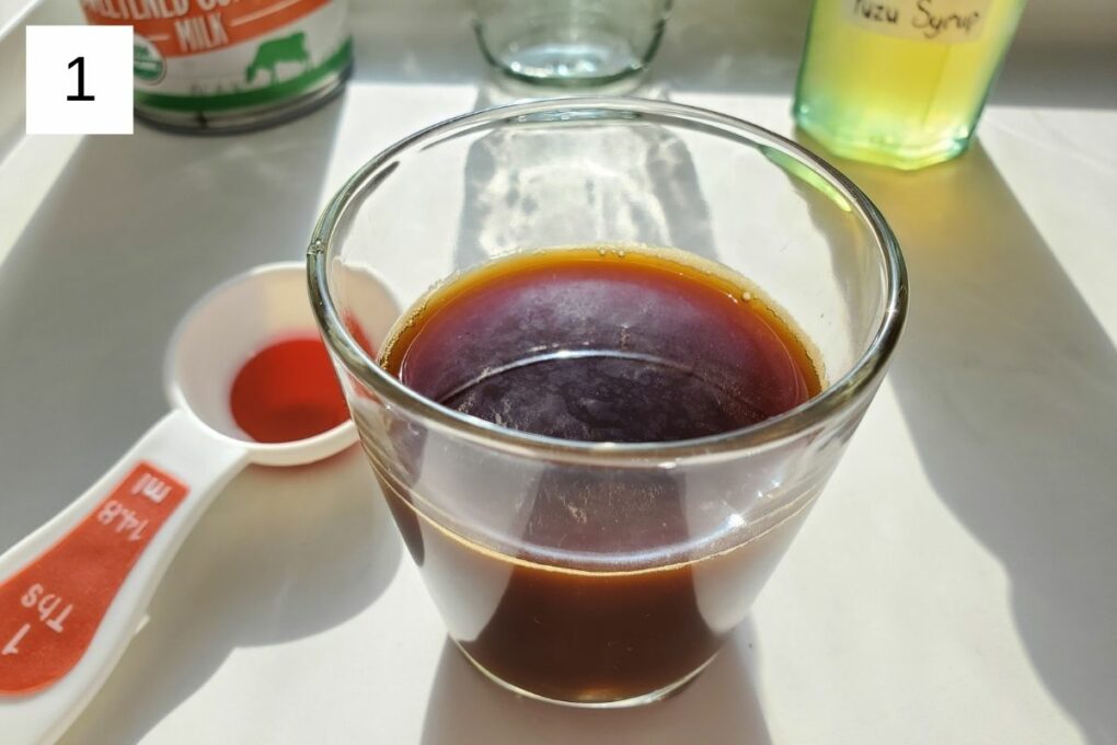 a glass of freshly brewed espresso