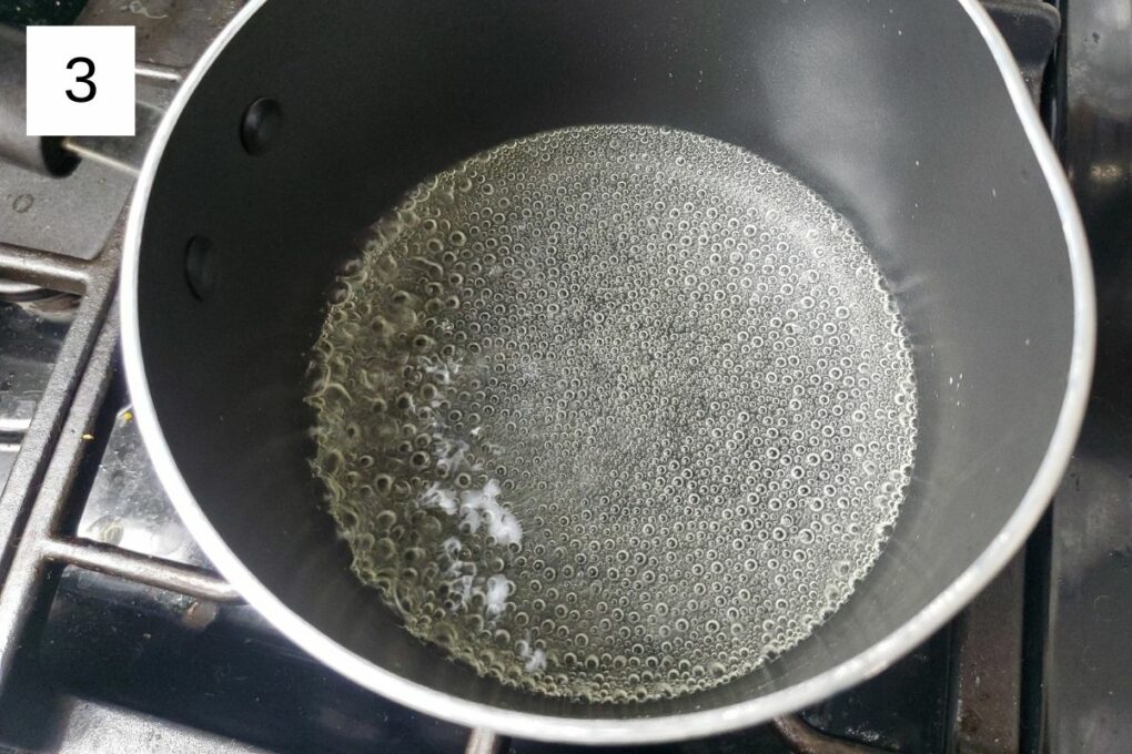boiling mixture of water and sugar in a pot