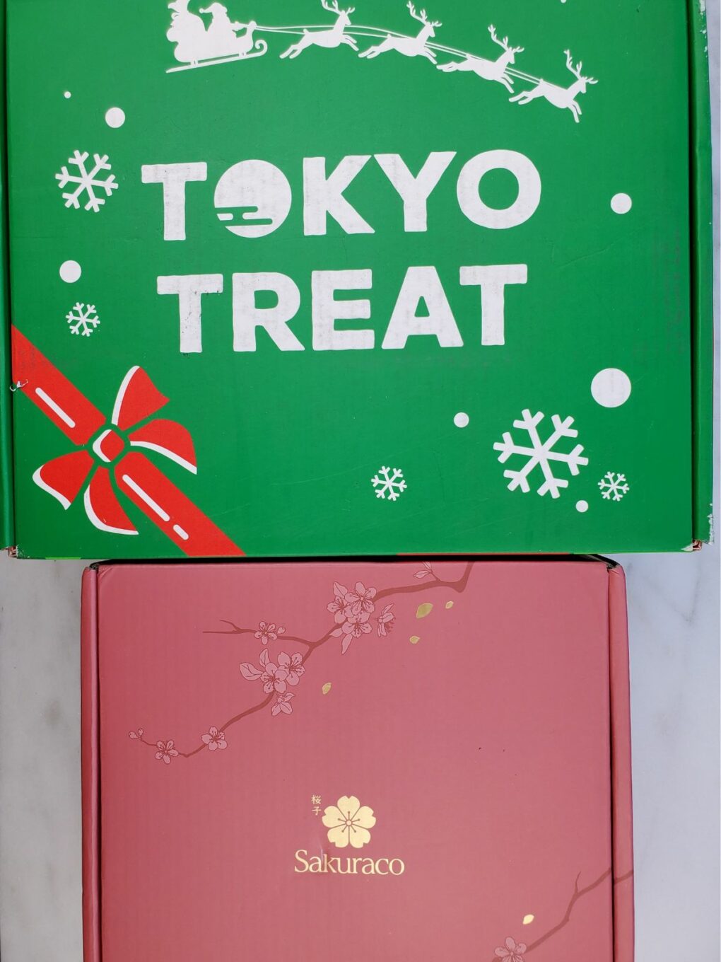 unopened tokyo treat and sakuraco boxes.