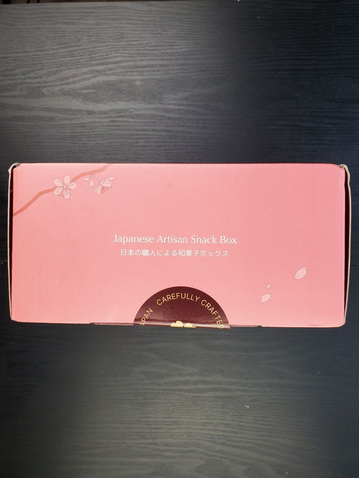 unopened sakuraco box on its side.