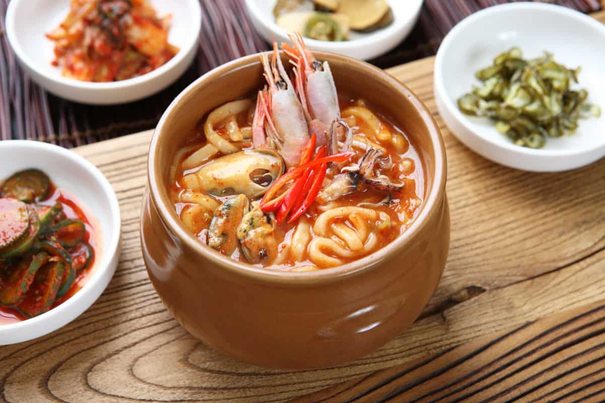 Seafood kalguksu in a pot.