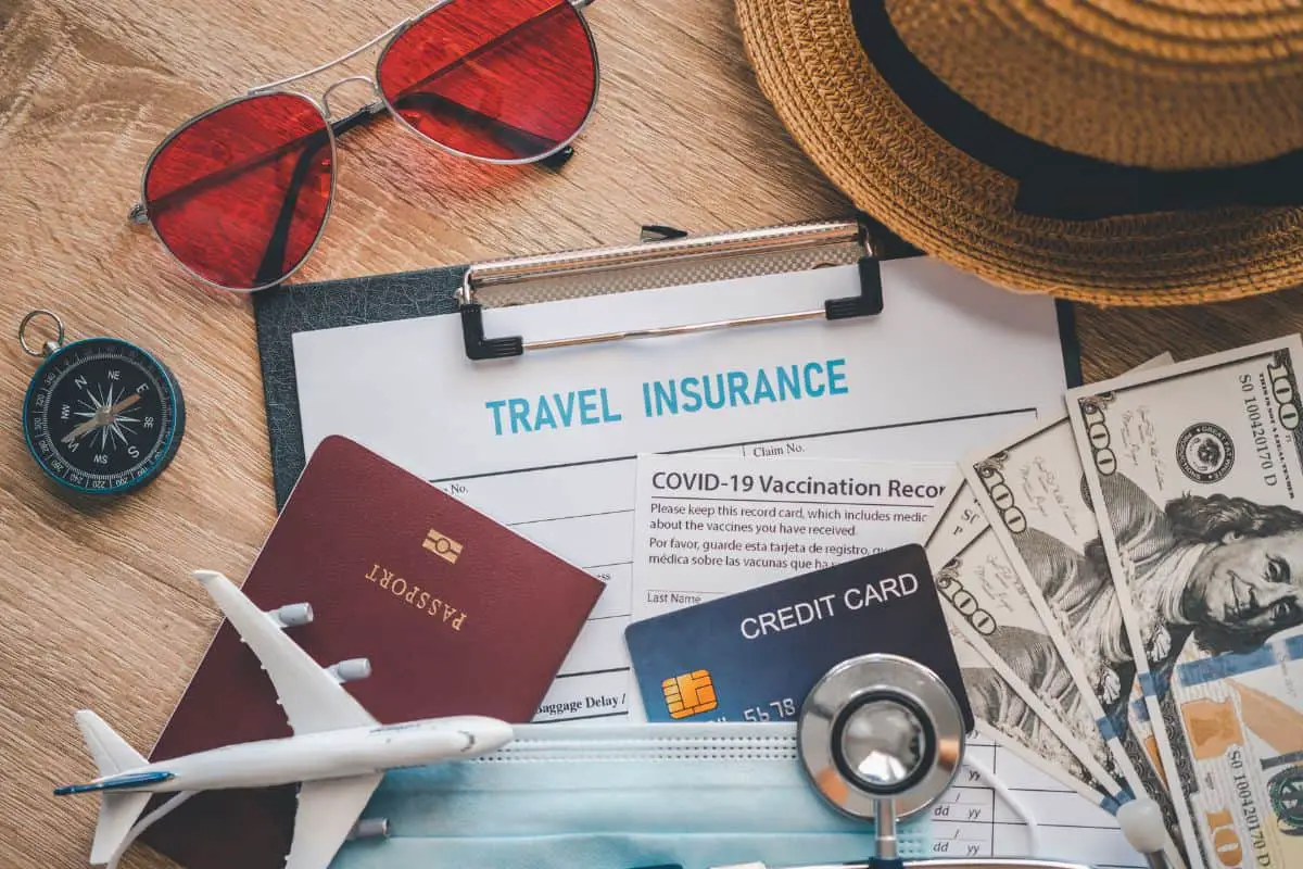 Travel insurance documents on the table.