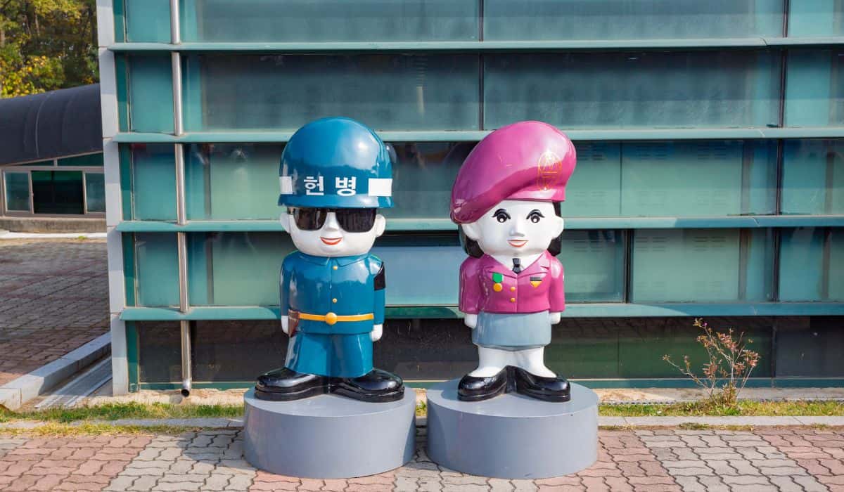 Statues of Korean policeman and woman inside the DMZ Third Infiltration Tunnel Site.