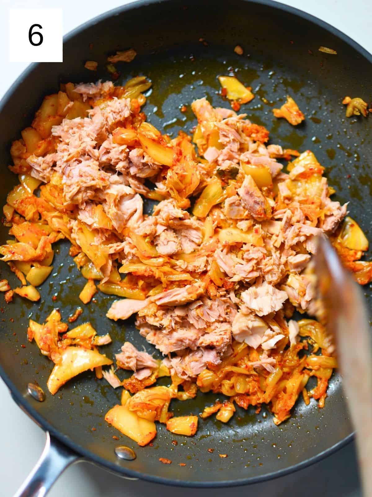 Kimchi and tuna in a pan.