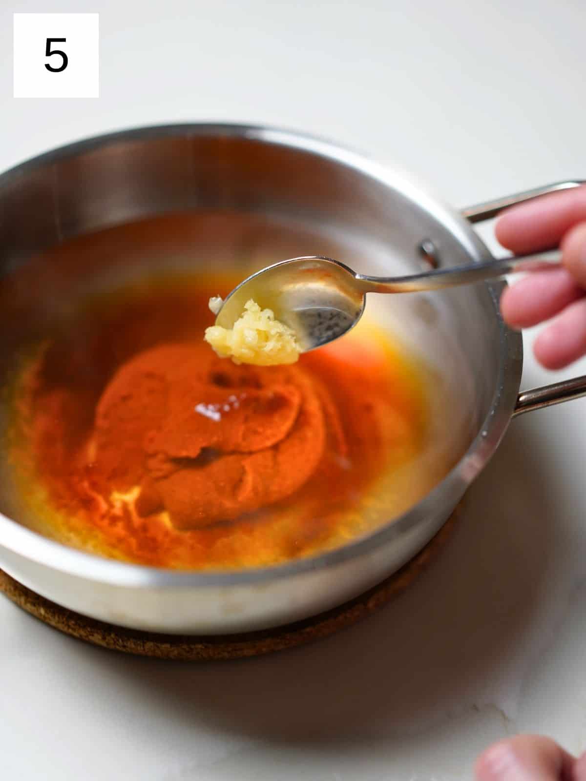 Mixing sauces and oil for rabokki.