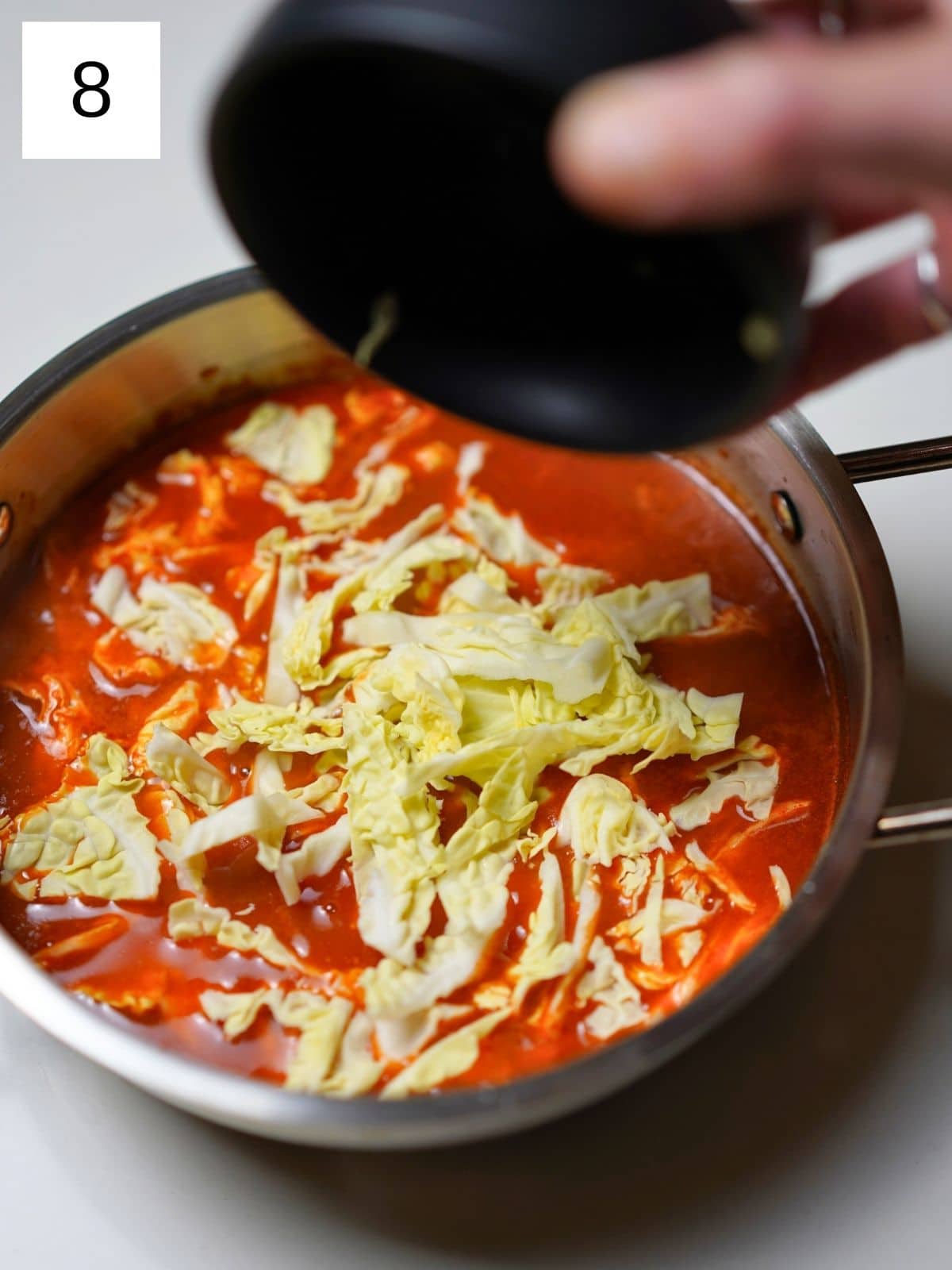 Cooking rabokki in a bowl.