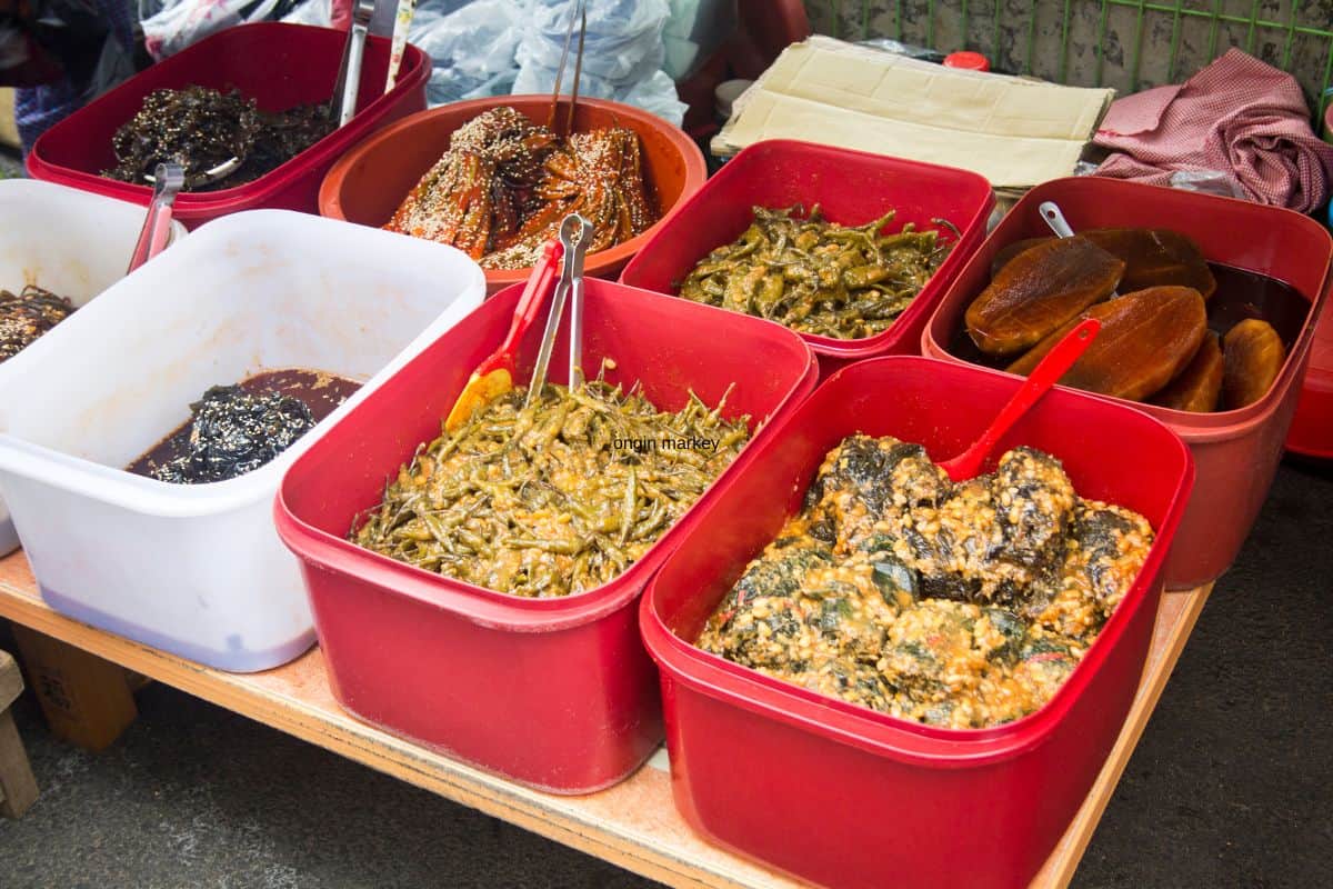 Selection for Korean side dishes in a traditional market in South Korea.