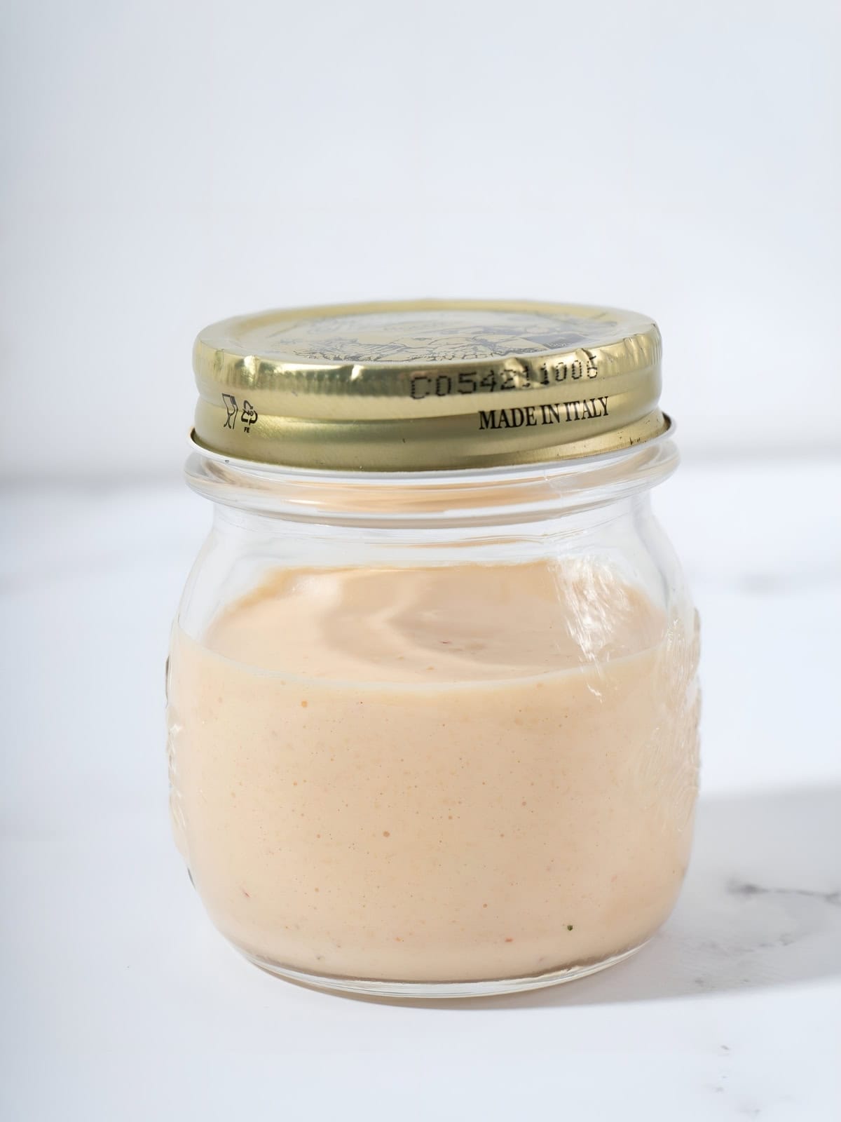 Homemade kimchi aioli in a jar.