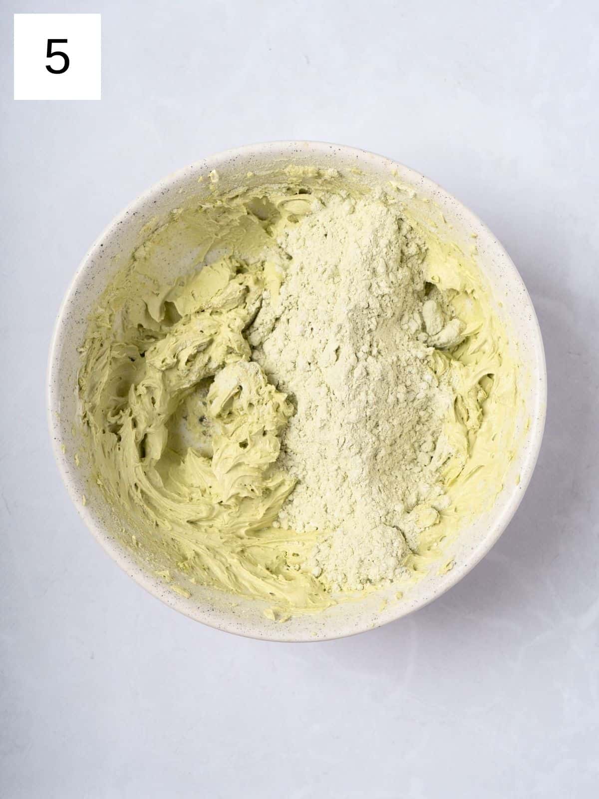 Matcha mixture and butter being mixed together.