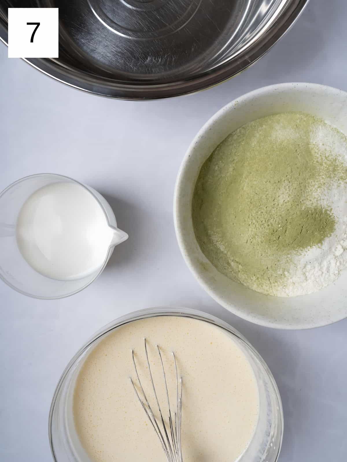 Egg and sugar mixture next to mixed matcha powder and cream.