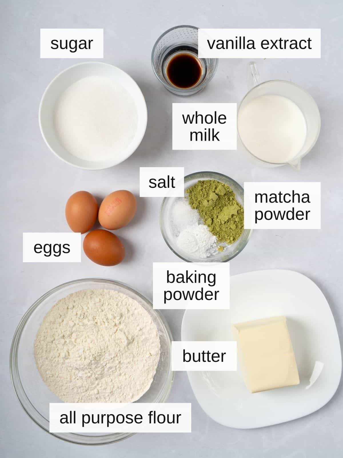 Matcha cake recipe ingredients including sugar, vanilla extract, whole milk, salt, matcha powder, butter, all purpose flour, and eggs.