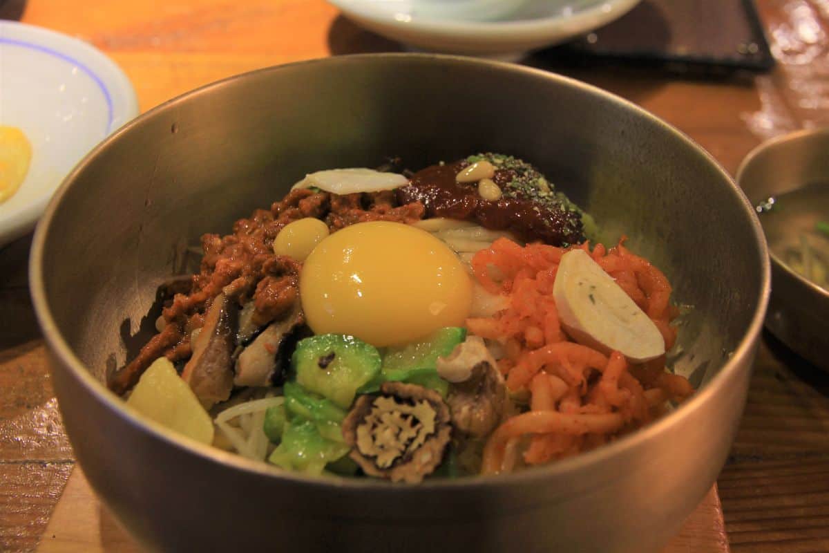 Traditional Jeonju bibimbap in a steel bowl.