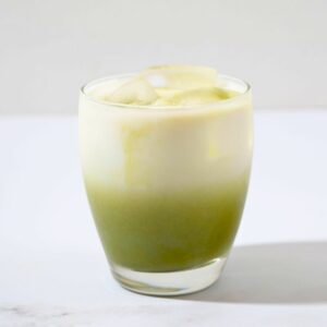 a nicely layered glass of matcha latte.