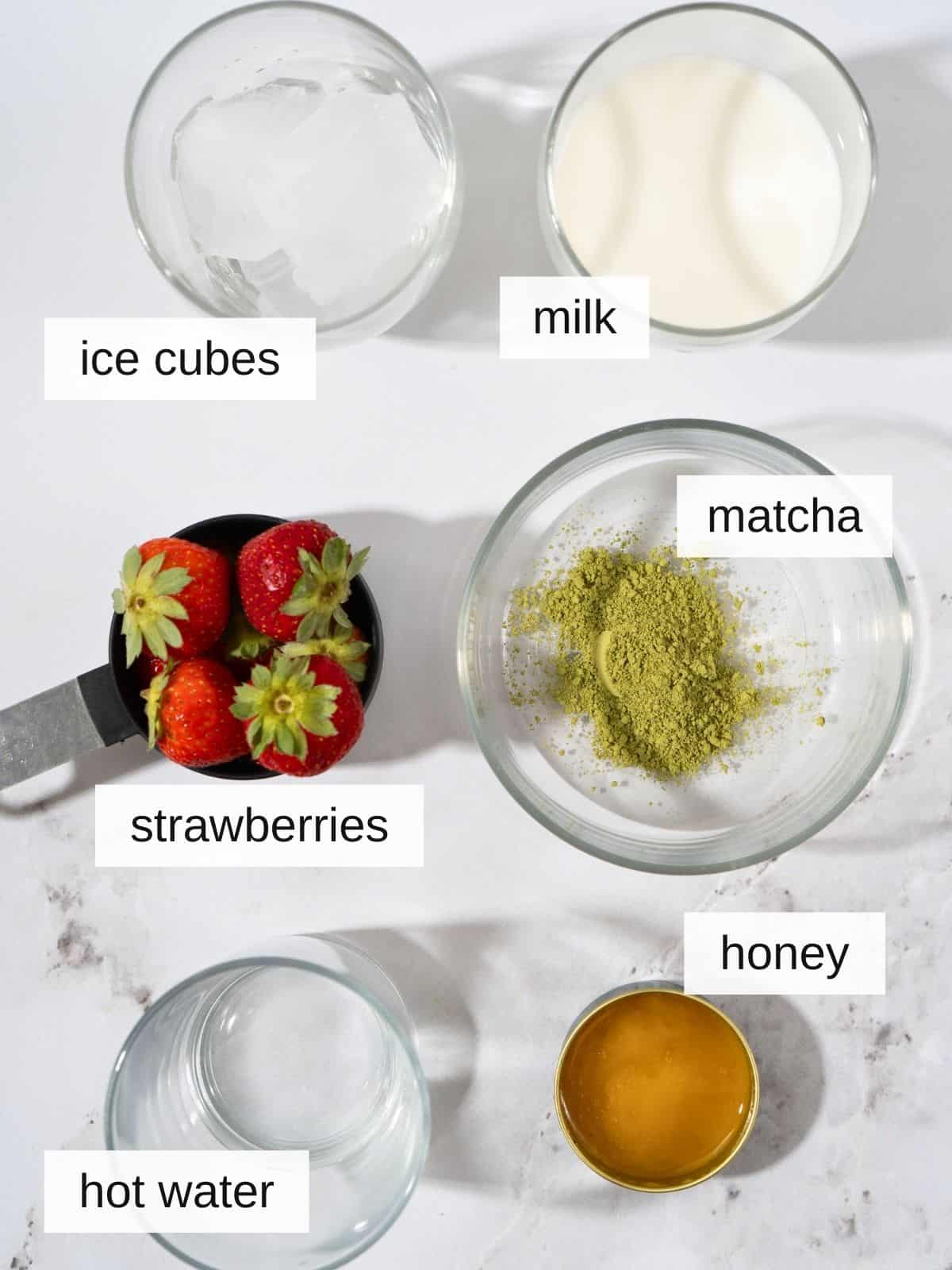 Iced strawberry matcha latte ingredients.