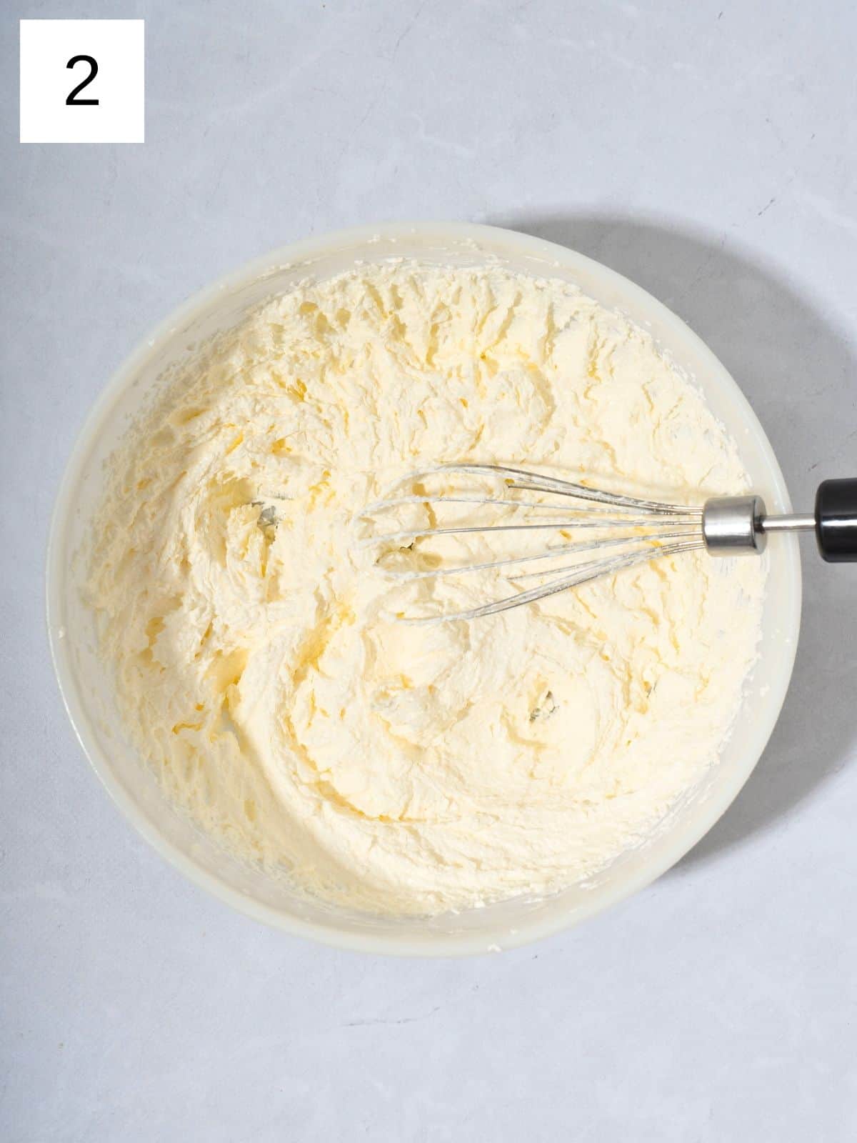 A bowl of flour combined with matcha powder and butter.