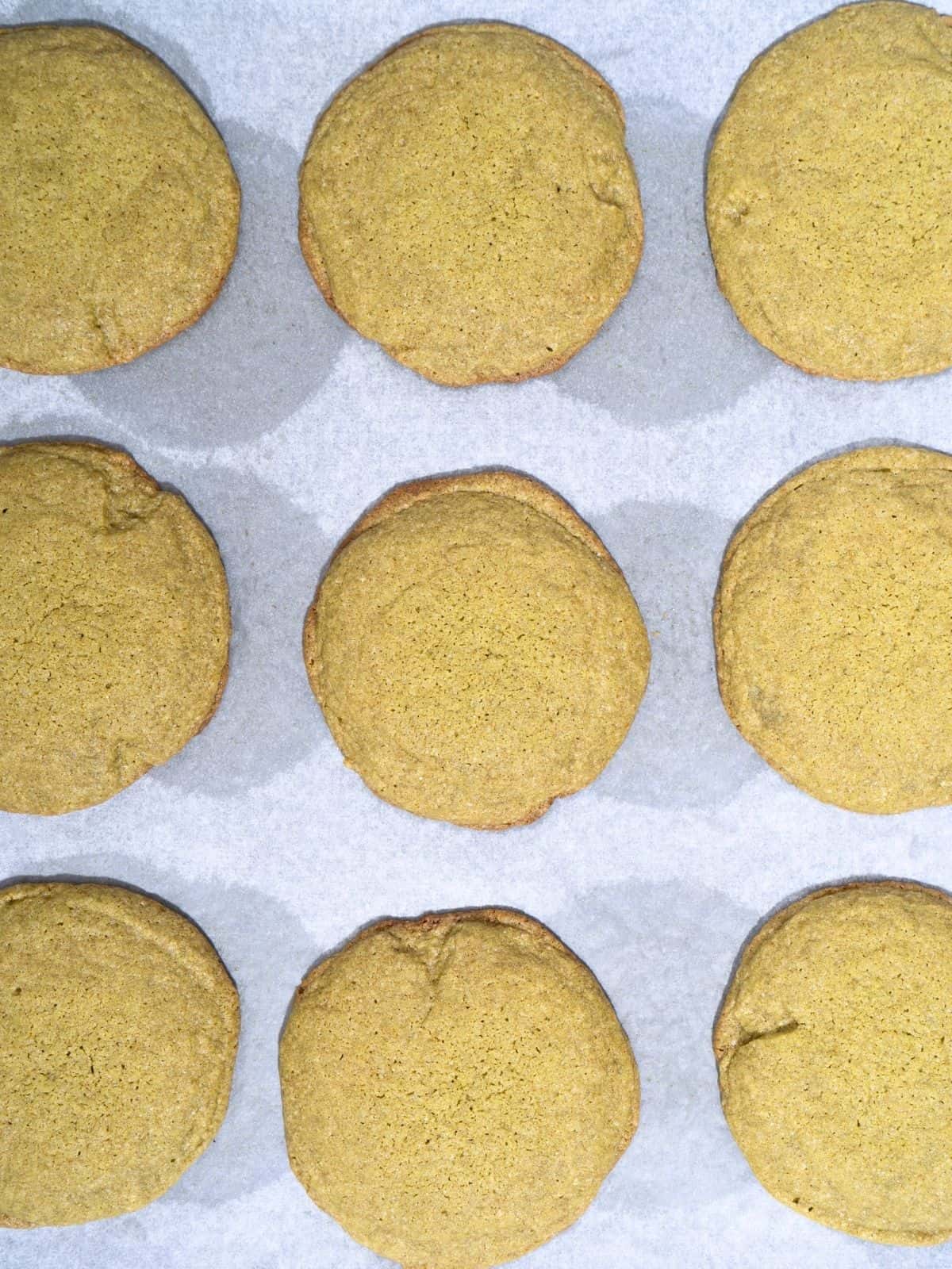 Matcha cookies on a baking sheet.