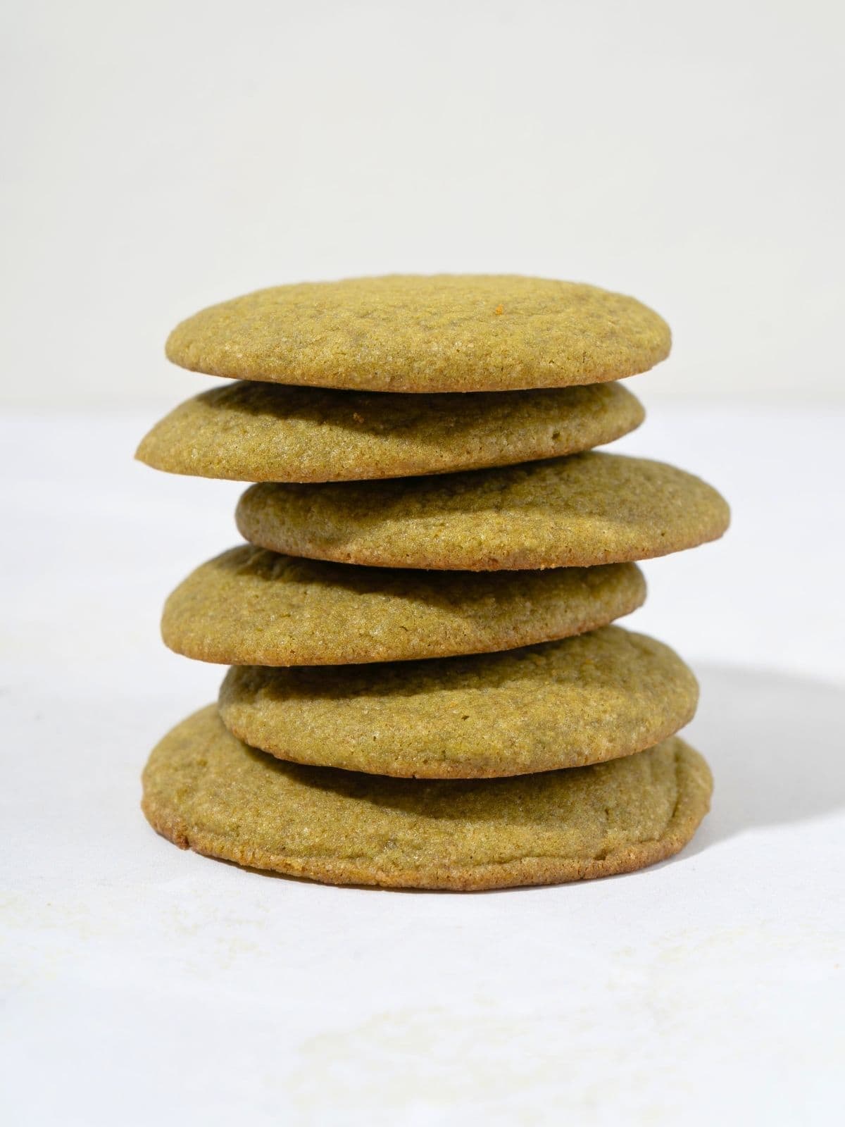 Stacked matcha cookies.