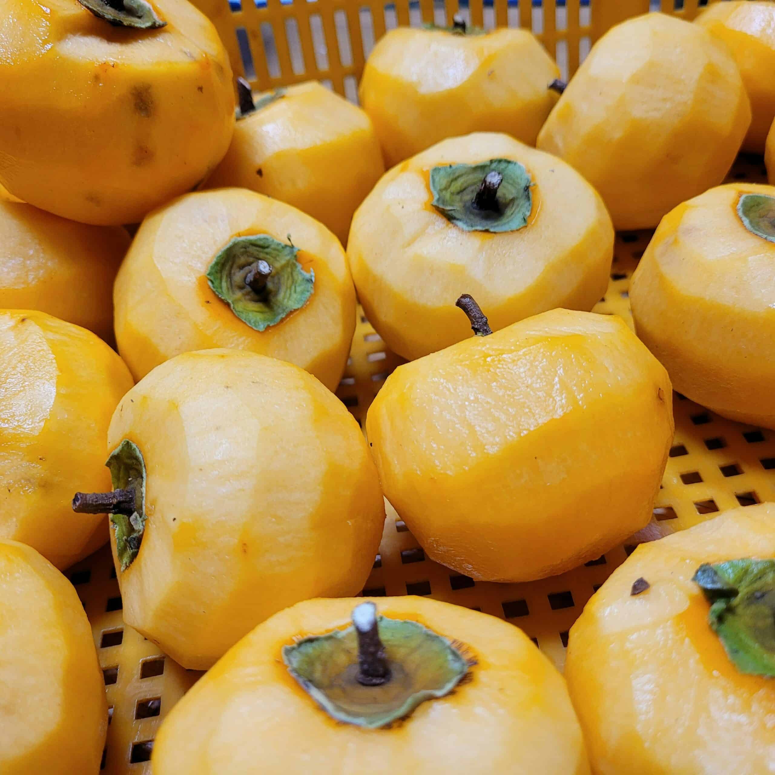 Persimmons in a basket.