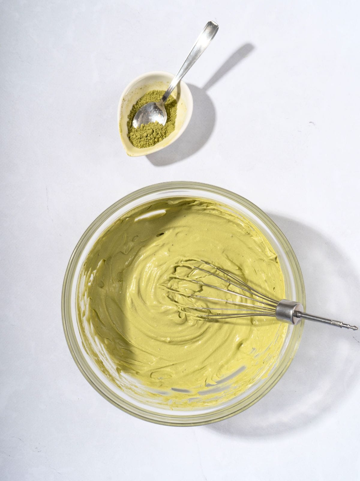 A bowl filled with matcha whipped cream.