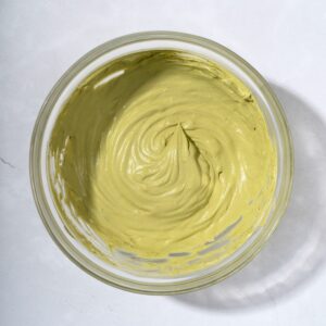 A bowl filled with matcha whipped cream.