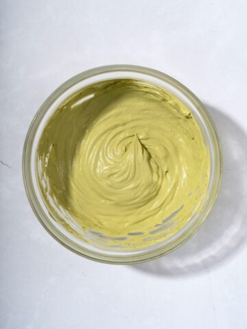A bowl filled with matcha whipped cream.