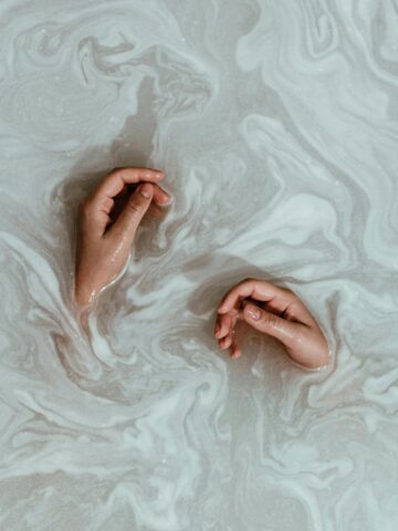 Hands soaked in water.