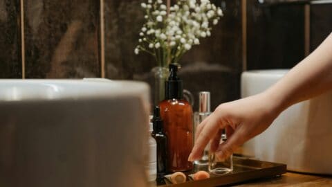 Skincare products on top of bathroom counter.