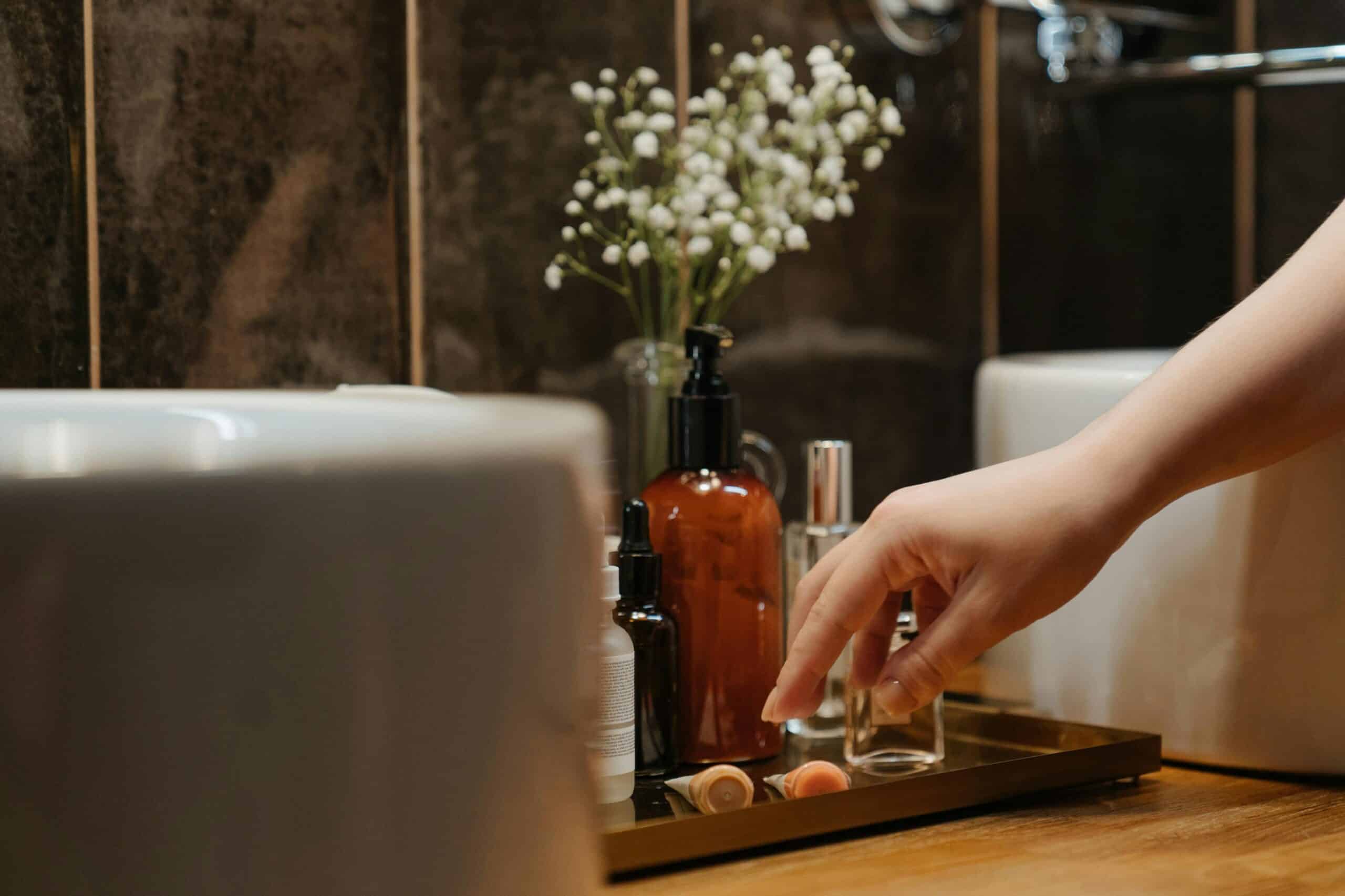 Skincare products on top of bathroom counter.