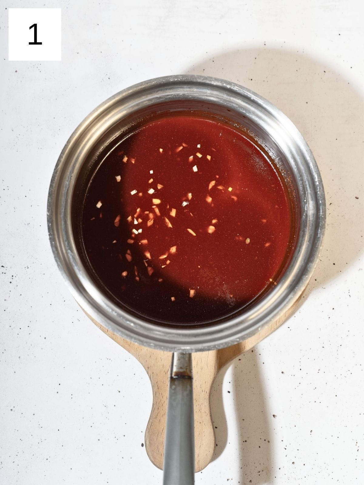 Honey gochujang mixture in a small saucepan.