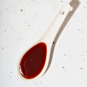 A spoonful of honey gochujang sauce.