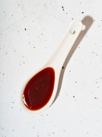 A spoonful of honey gochujang sauce.