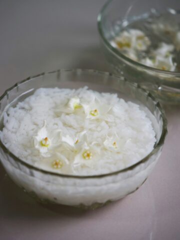 rice soaked in water in a small bowl.