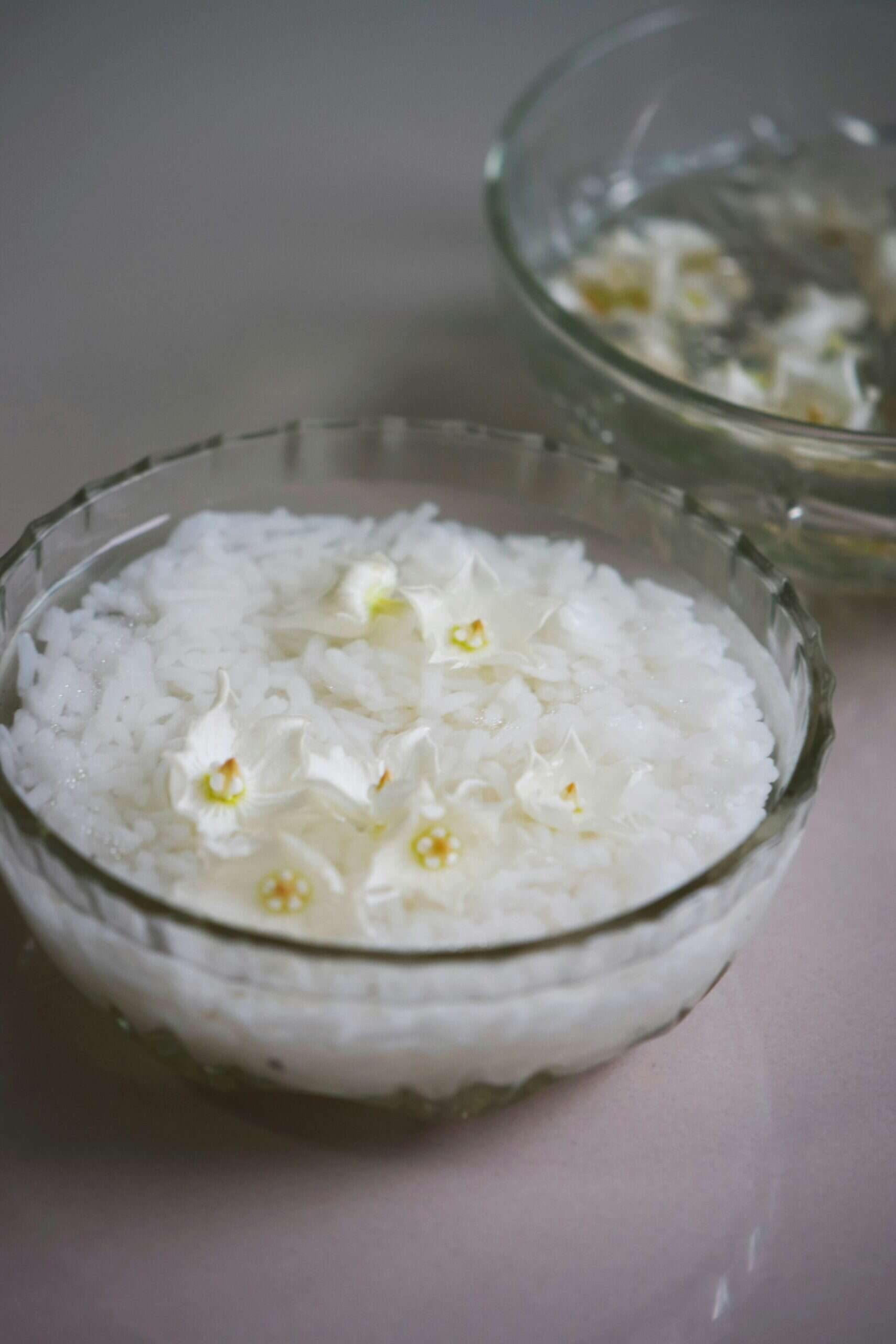 rice soaked in water in a small bowl.