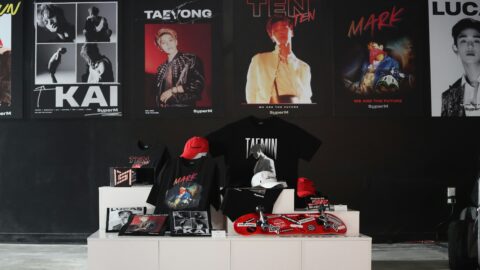 K-pop themed merchandise display with posters, caps, and skateboards in Seoul Korea Asia.