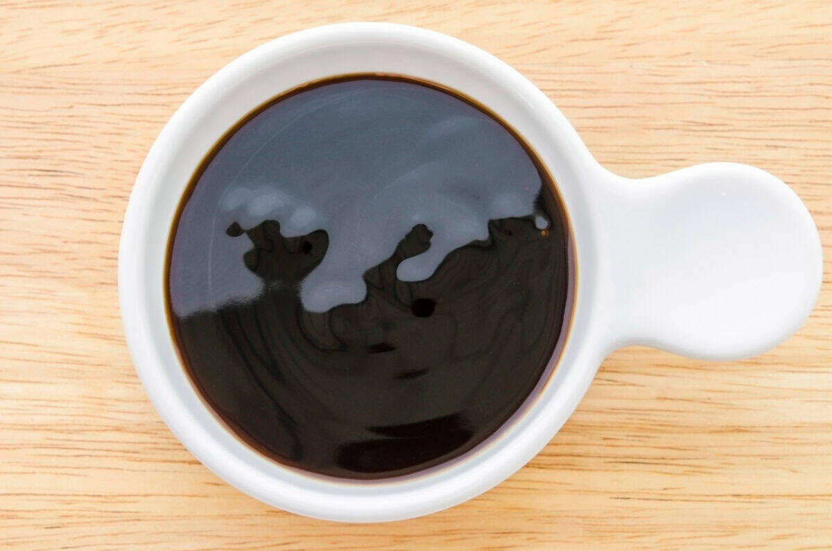 A sauce bowl of thick hoisin sauce.