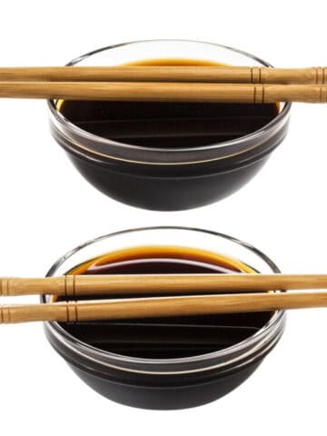 Two glass saucer filled with hoisin sauce and oyster sauce.