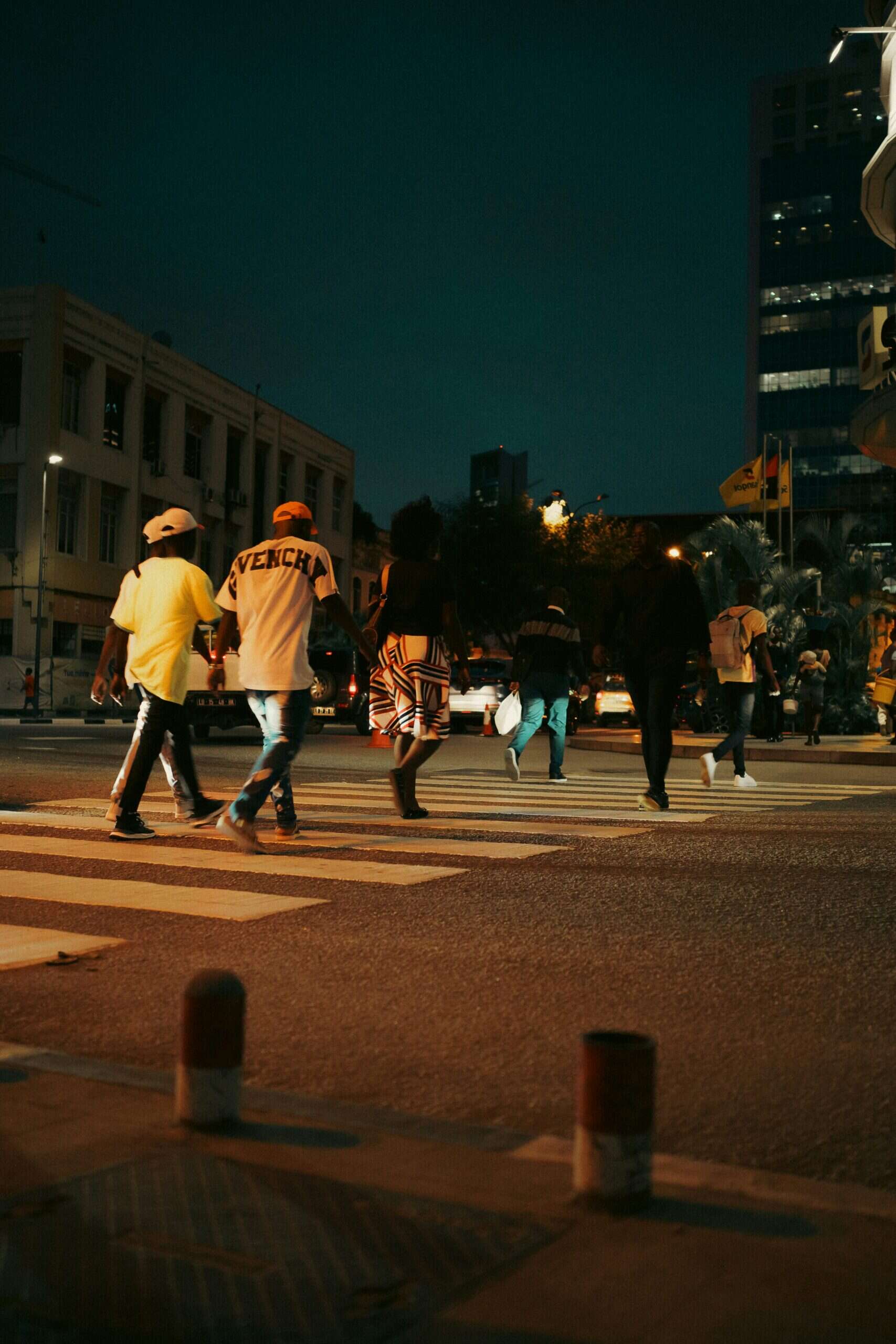 Bright city nightlife scene in Seoul Korea Asia, people crossing the street at dusk.