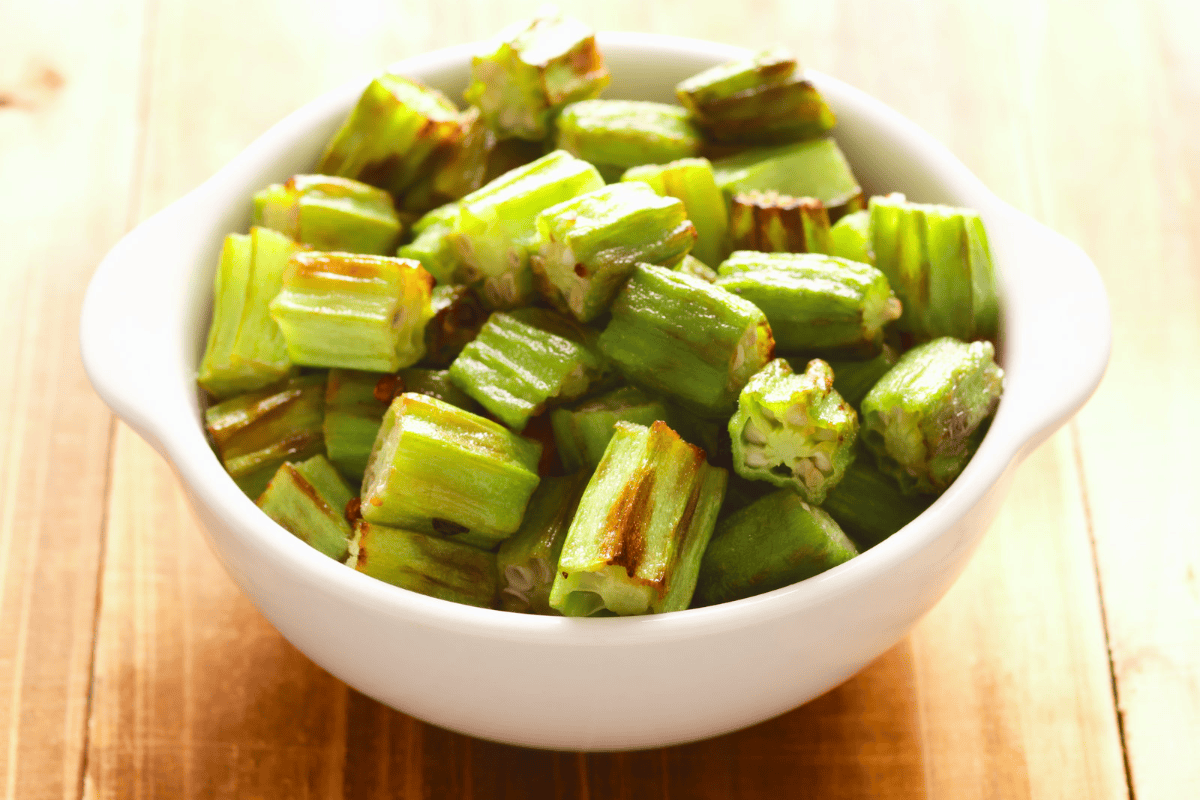Roasted sliced okra in a white bowl.