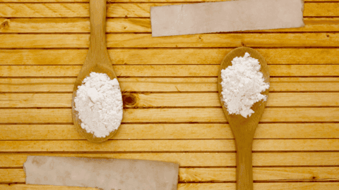 Two spoons full of cornstarch and flour.