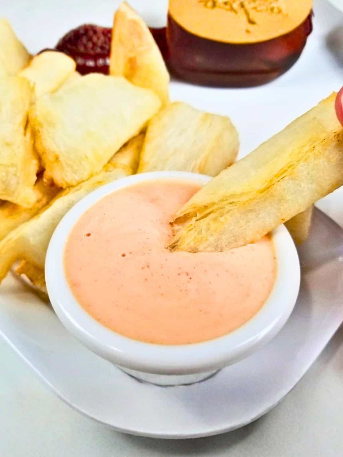 Yuca fries on a sriracha mayo dip.