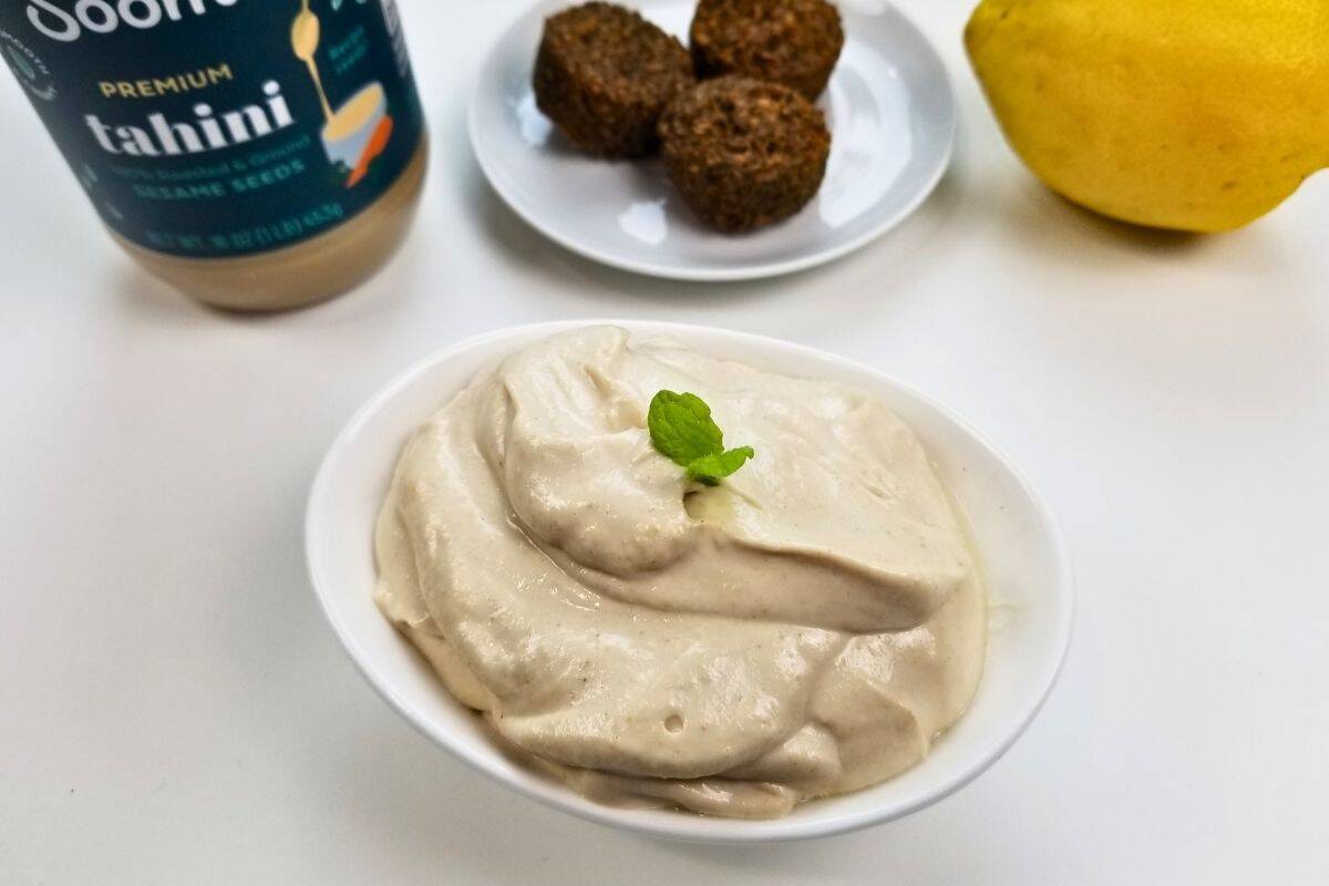 Tahini sauce in a saucer.