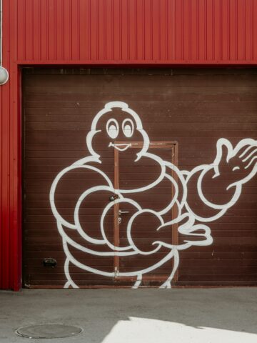 Michelin Man graffiti on red industrial building in Seoul, Korea.