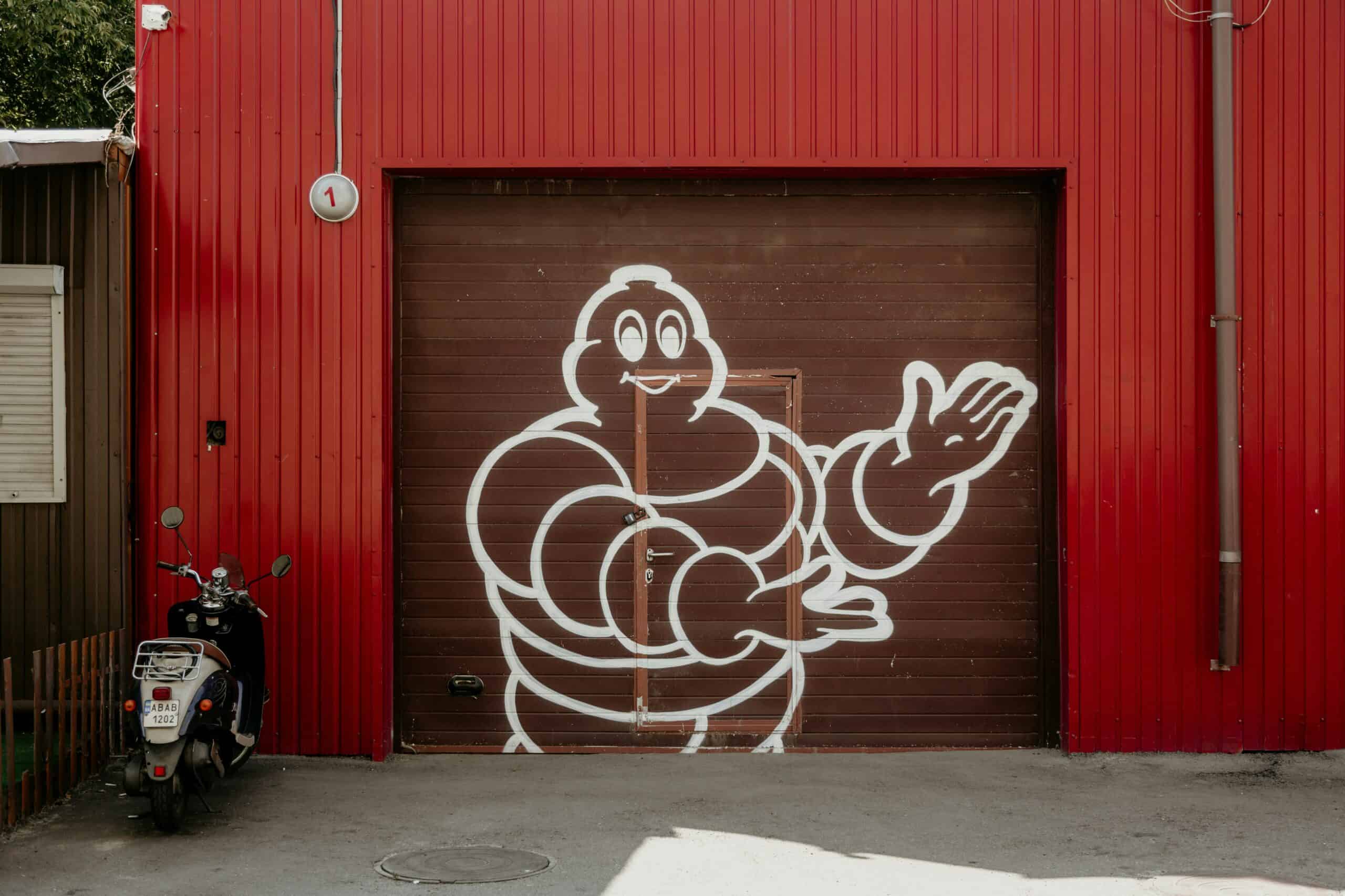 Michelin Man graffiti on red industrial building in Seoul, Korea.