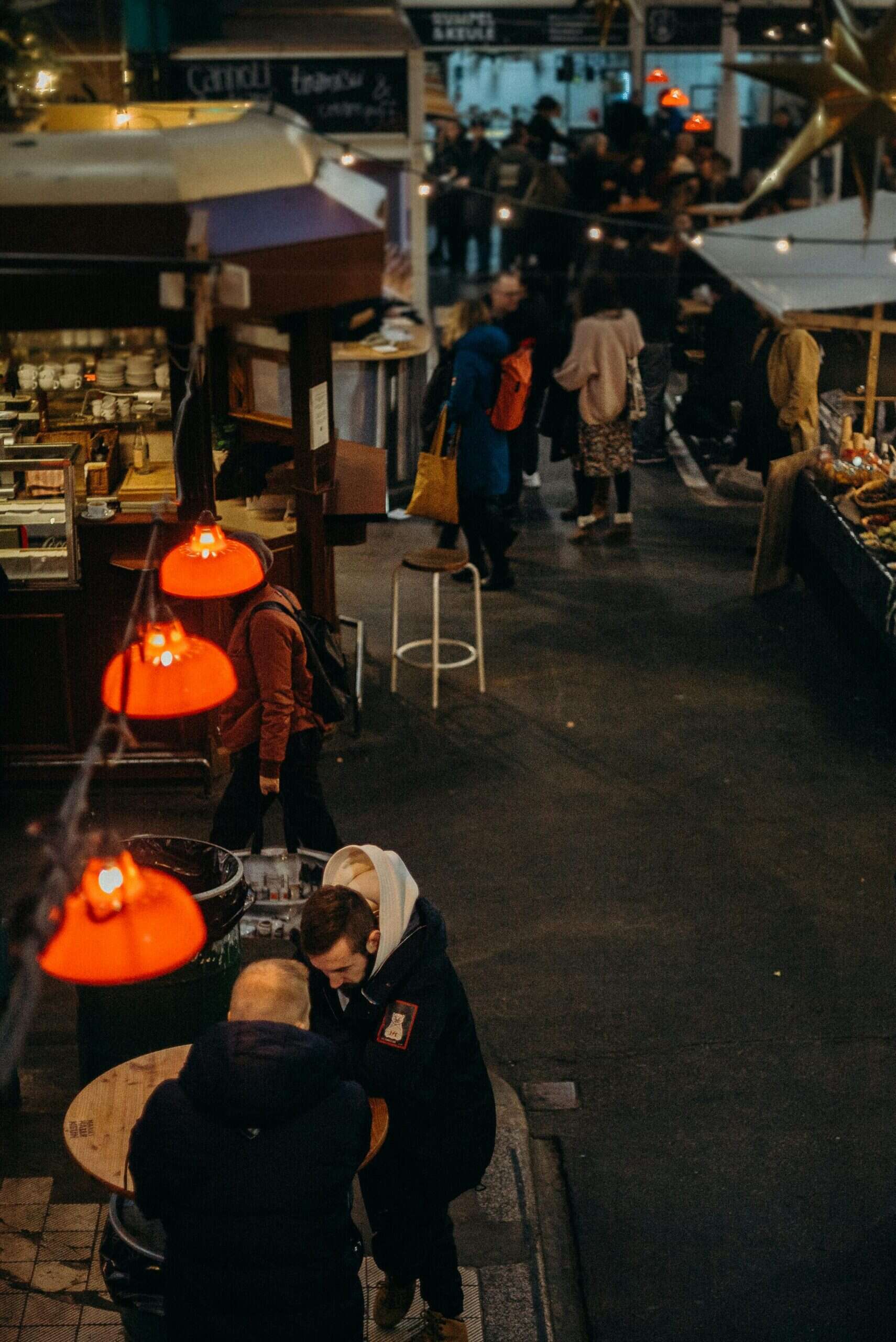Night market scene in Seoul, Korea with shoppers and vibrant stalls.